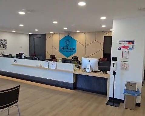 Bow Care Clinic reception desk facing the BowCare hexagon sign