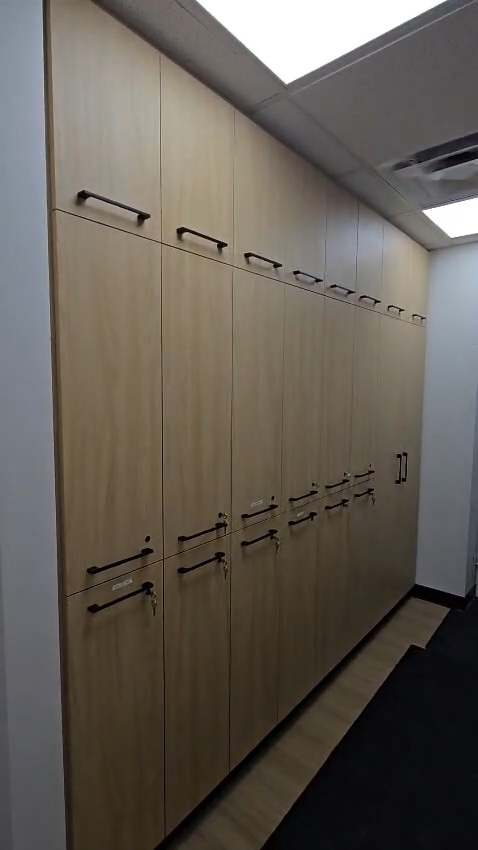 Bow Care Clinic corridor with wood-tone cabinetry