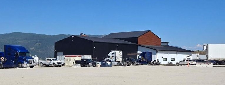 Integrity Buildings loading dock area with semi-trucks and trailers