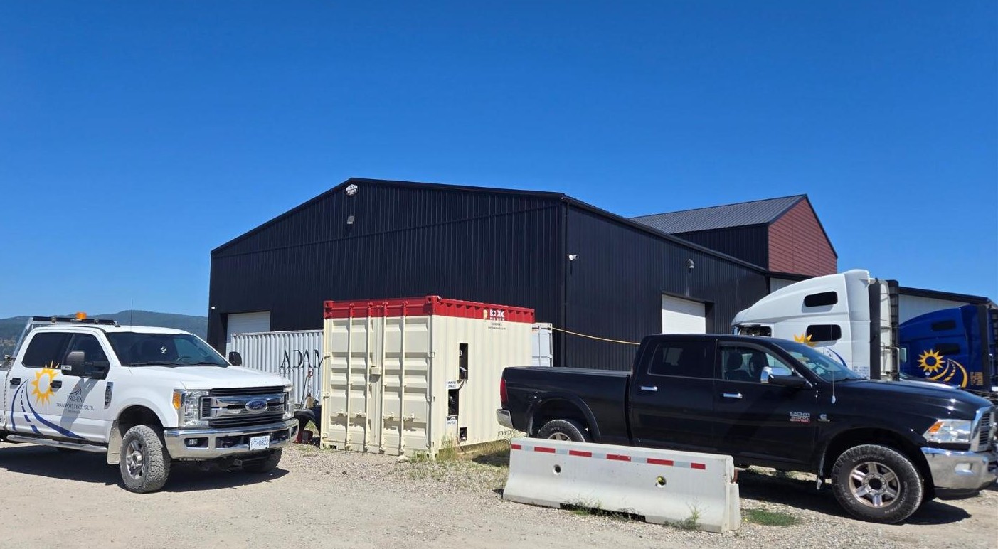 Integrity Buildings warehouse exterior with trucks and trailer