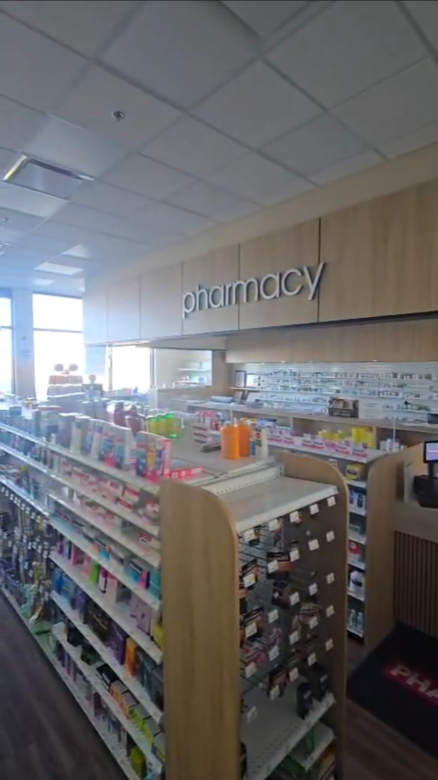 Pharmasave Sage Hill wide interior view of retail aisles